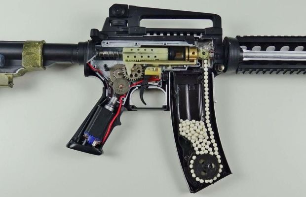 The internals of an electric airsoft gun.